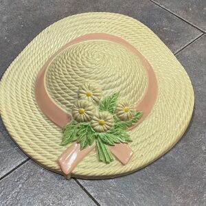 Decorative Cream and Pink Hat Wall Accent plastic.